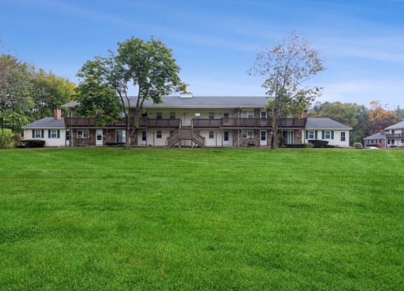 View of Stonebridge apartment building with beautiful landscape at Stonebridge, Ellington, Connecticut