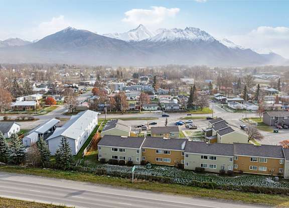 A small town with a mountain in the background.