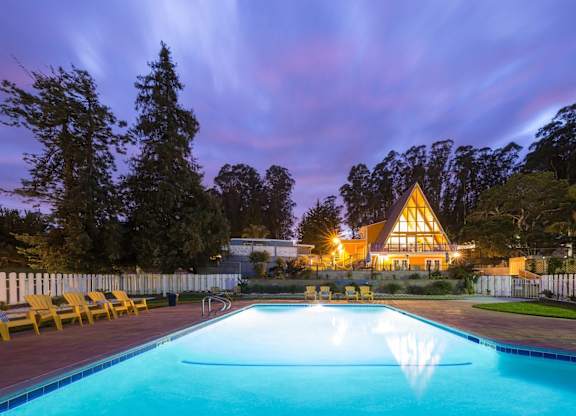 pool view with the main cabin in the background at Salinas Sunset Apartments, Salinas, CA, 93907