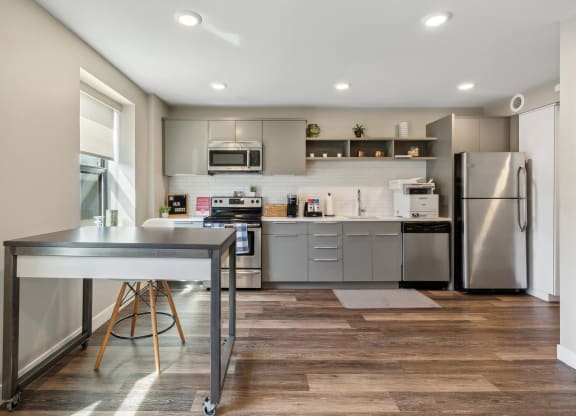 a modern kitchen with stainless steel appliances and a counter top at The Rowe, Michigan