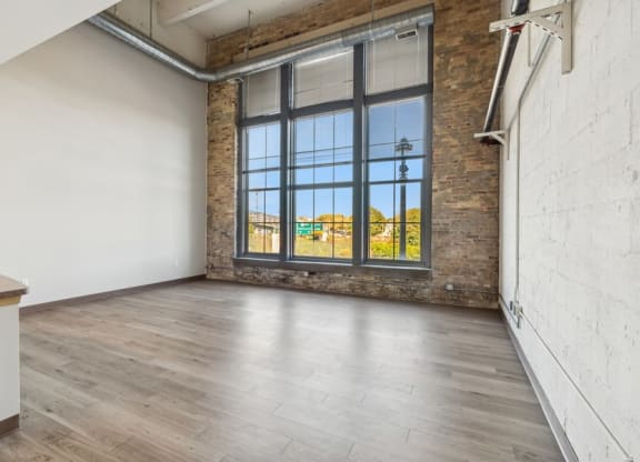 living room with a window and wood floors