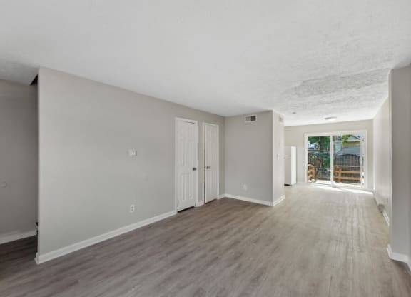 an empty living room with a door to a patioat Fort Collier Terrace, Winchester, VA