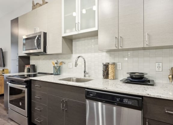a kitchen with a sink and a microwave