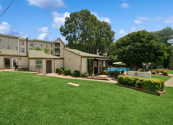 A sunny day at the apartment complex with a swimming pool.