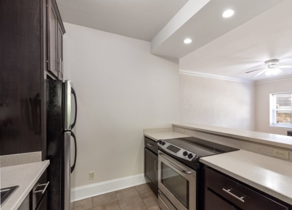 a kitchen with stainless steel appliances and a counter top