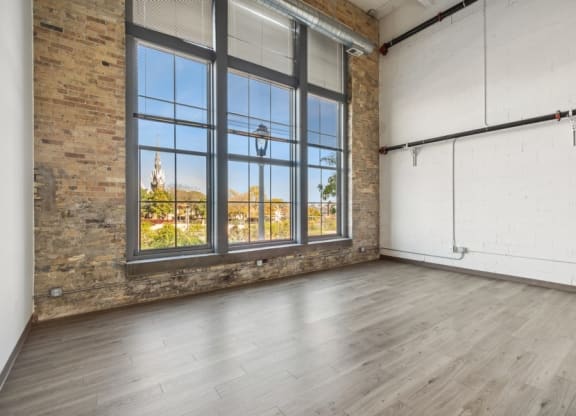 Living room with large window and wood floors