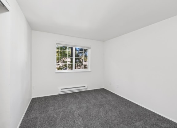 a room with a window, white walls, and carpet flooring at Murrayhill Park, Beaverton Oregon