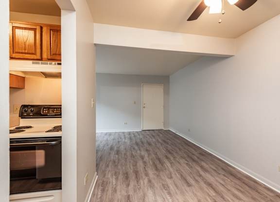 A kitchen with a stove top oven and a microwave.
