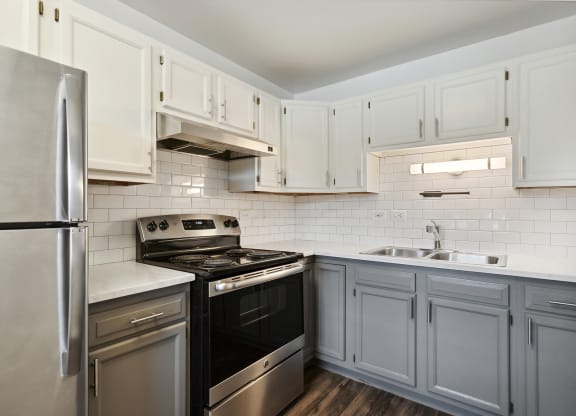 a kitchen with stainless steel appliances at The Hinsdale, Hinsdale, Illinois