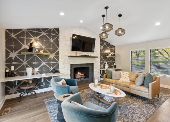 interior club room with sitting area and fireplace  at Ascent at Farmington Hills, Farmington Hills, MI
