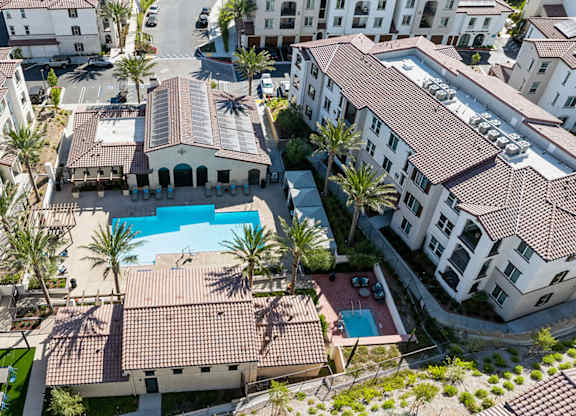 A bird's eye view of a resort with a swimming pool.