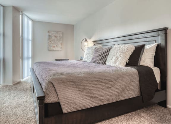 a bedroom with a bed and a window at St. Charles, St. Charles, IL