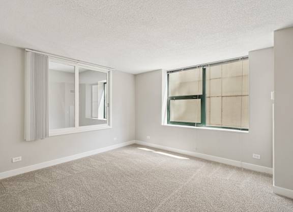 A room with a window and a door.