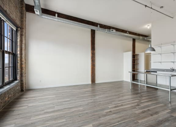 an empty room with white walls and wood floorsat Gaar Scott Historic Lofts, Minneapolis, 55401