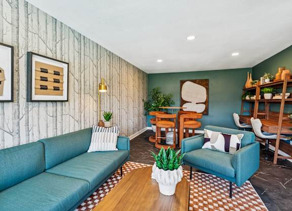 A living room with a blue couch and a wooden coffee table.