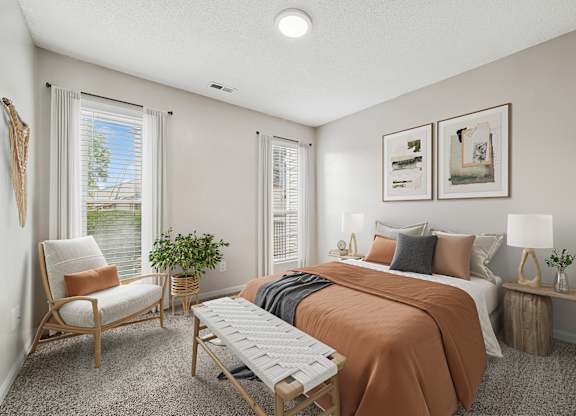 A bedroom with a bed, chair, and window.