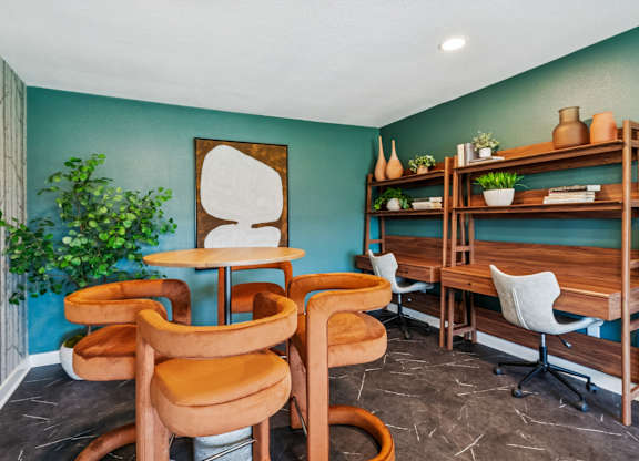 A room with a blue wall and a wooden shelf.