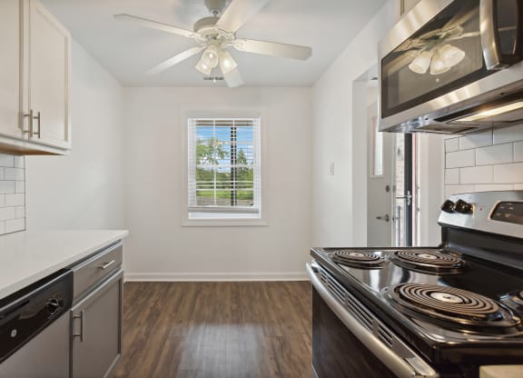 a kitchen with stainless steel appliances and a ceiling fan at The Hinsdale, Hinsdale, IL, 60521