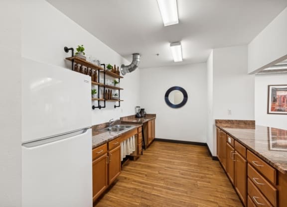 a kitchen with wooden cabinets and a white refrigerator