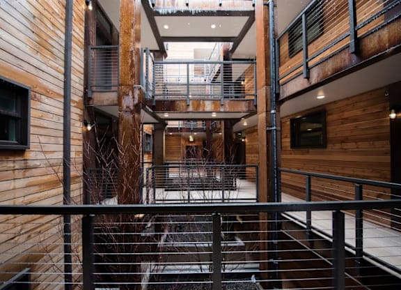 Multi level interior courtyard with wood balconies at Brooklyn Yard Apartments, Oregon