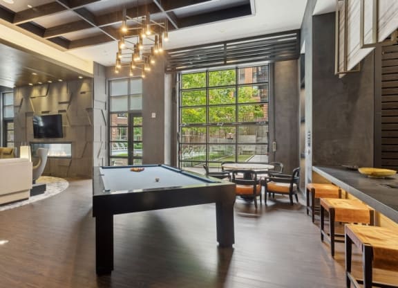 a pool table in the middle of a living room