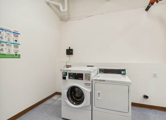 a laundry room with a washing machine and a dryer