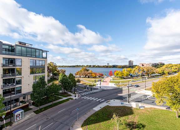 Waterfront view with lakeside park and crosswalk at 1800 Lake Apartments, Minneapolis, MN 55408