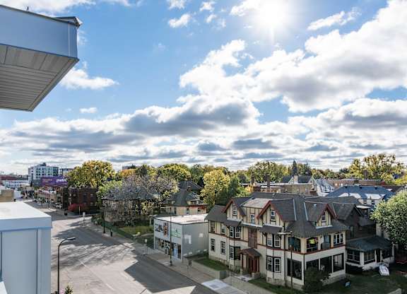 Aerial view of neighborhood streets and rooftops at 1800 Lake Apartments, Minneapolis, 55408
