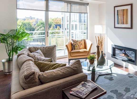 Contemporary living room with floor to ceiling windows at 1800 Lake Apartments, Minneapolis, Minnesota