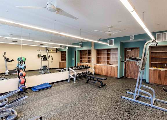 Fitness center with free weights and exercise equipment at 1800 Lake Apartments, Minneapolis, MN