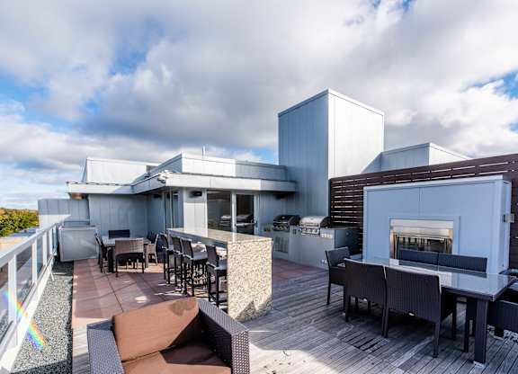 Rooftop patio with grills and outdoor dining at 1800 Lake Apartments, Minneapolis, MN 55408