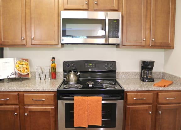 Apartment kitchen view of oven, stove top and microwave at Mallory Ridge, Bloomfield, CT, 06002