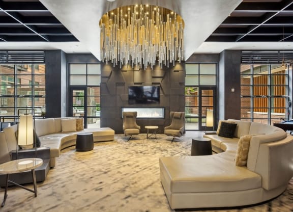a large living room with a chandelier and a fireplace