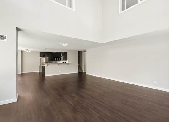 A room with wooden floors and white walls.
