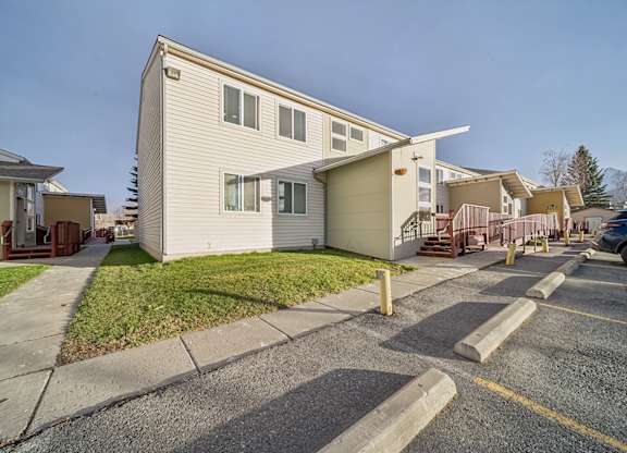A residential area with houses and a parking lot.