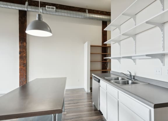 a kitchen and dining area in a 555 waverly unitat Gaar Scott Historic Lofts, Minnesota