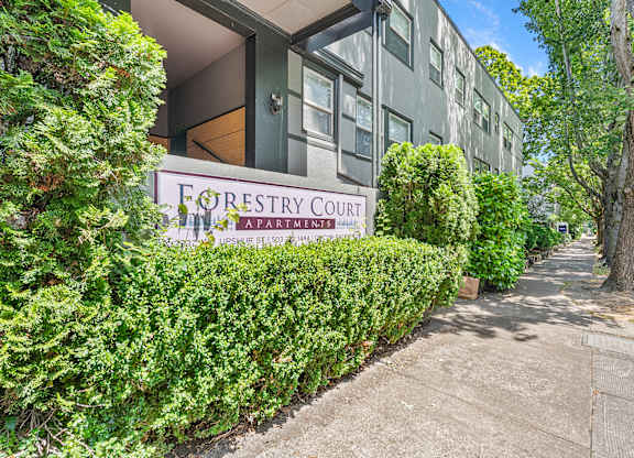 A building with a sign that says Forestry Court.