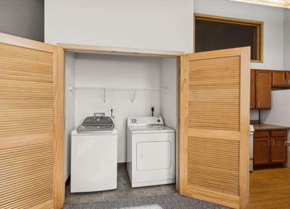 a laundry room with a washing machine and a dryer in it