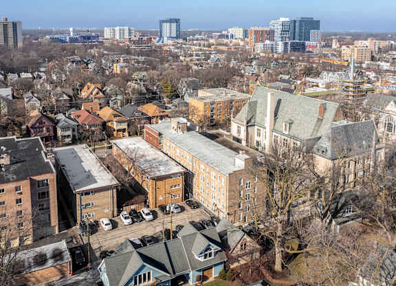 A cityscape with buildings and trees in the foreground at Pleasant Oak Apartments, Oak Park, 60302