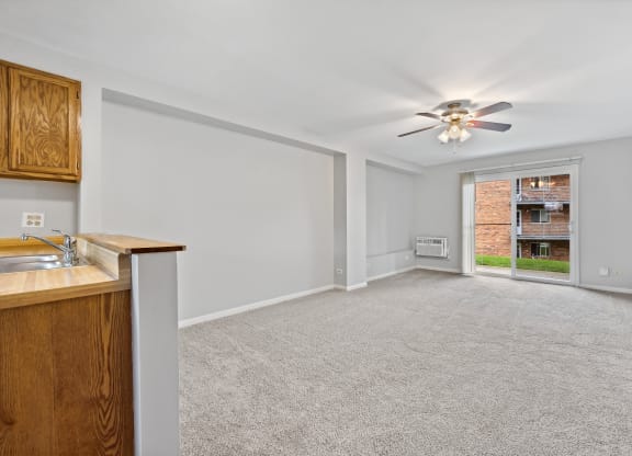 White interior with wooden cabinets at River Oaks, North Aurora, IL