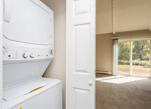 view from the laundry room into the living room with sliding room