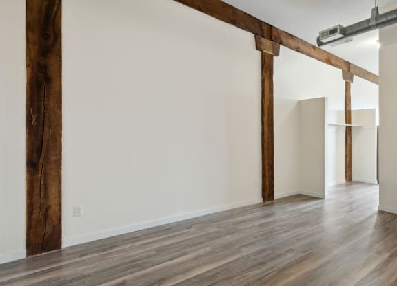 an empty room with white walls and wood floorsat Gaar Scott Historic Lofts, Minneapolis, MN, 55401