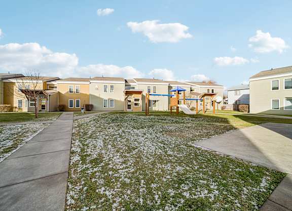 A residential area with houses and a playground.
