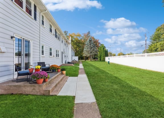 Back side of the apartments with pretty landscape and plants at Fox Hill Commons, Connecticut, 06066