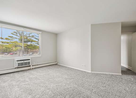 A room with a window and a door.