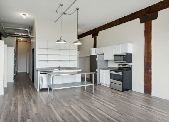 a kitchen and dining area in a 555 waverly unitat Gaar Scott Historic Lofts, Minnesota, 55401