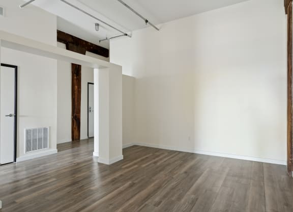 an empty room with hardwood floors and white wallsat Gaar Scott Historic Lofts, Minneapolis, Minnesota