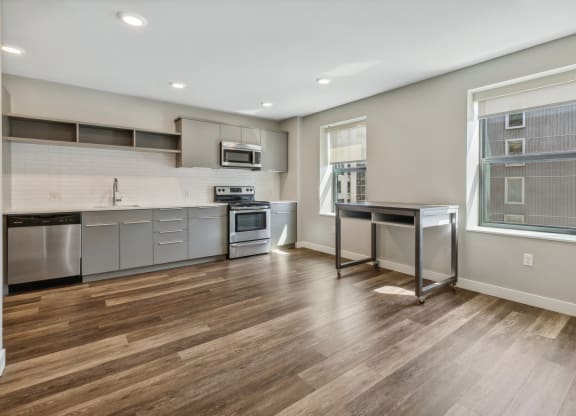 an open kitchen with stainless steel appliances and a window at The Rowe, Michigan