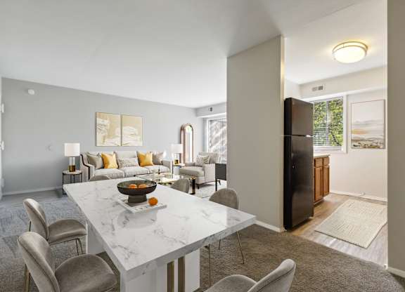 A modern dining room with a marble table and chairs.