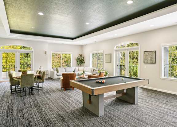 Clubhouse with a pool table and chairs